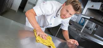 chef disinfecting a food prep are with FSAN a NRCS registered disinfectant