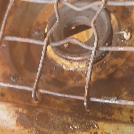 A revolting briaa burner before cleaning with Habitat oven cleaner
